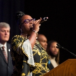Woman singing on stage